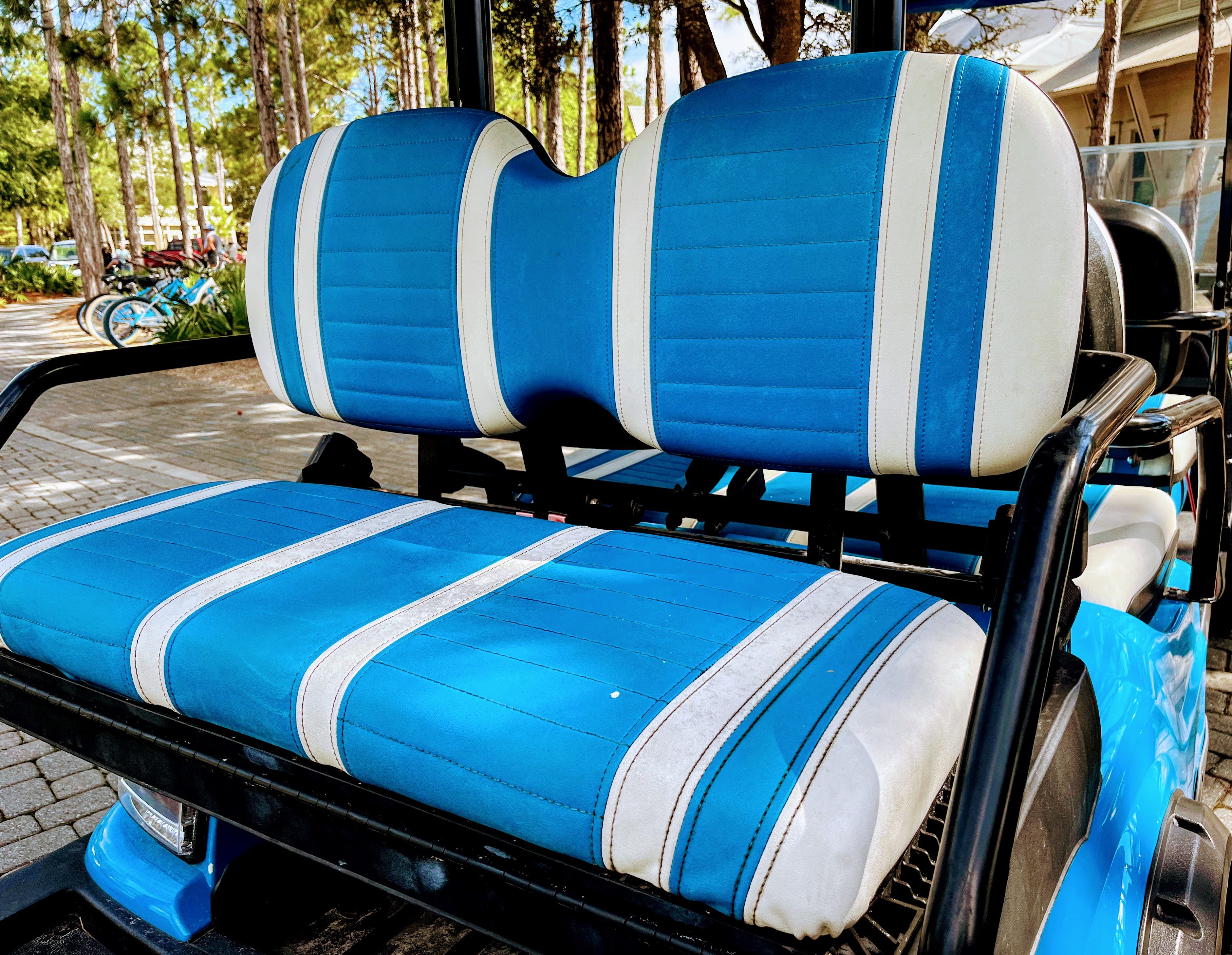 turquoise and white golf cart seats