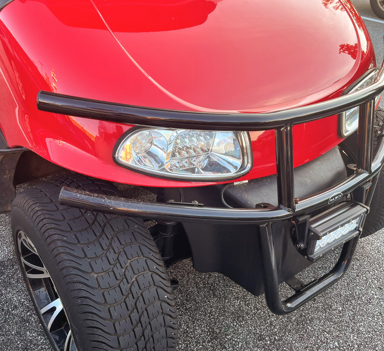 black golf cart brush guard on red EZ GO golf cart