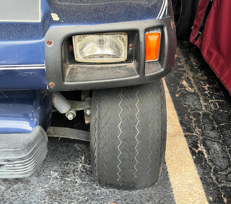 worn tread on a golf cart tire
