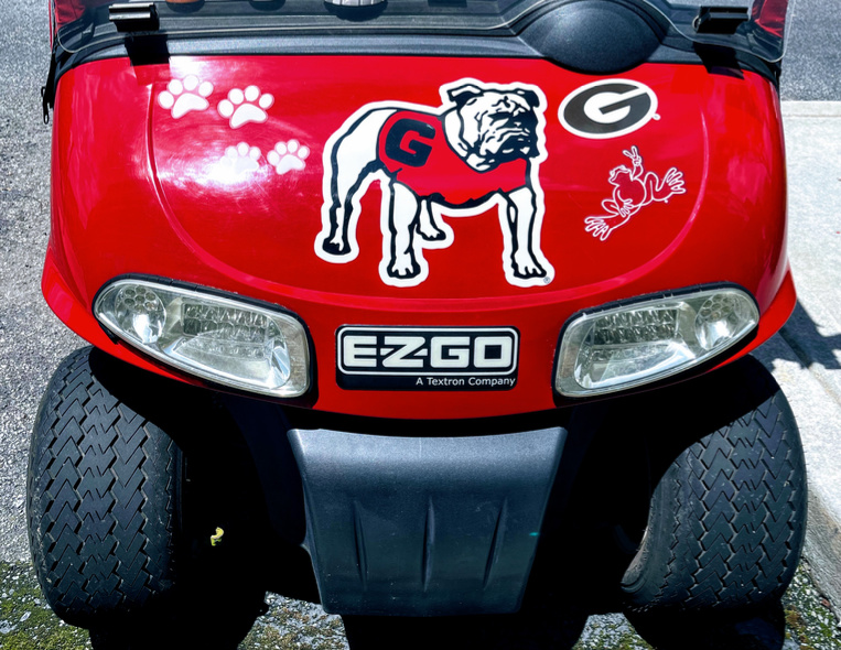 Georgia Bulldog decals on a red EZGO golf cart 