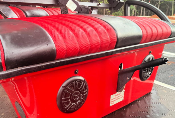 two marine grade golf cart speakers under front seat