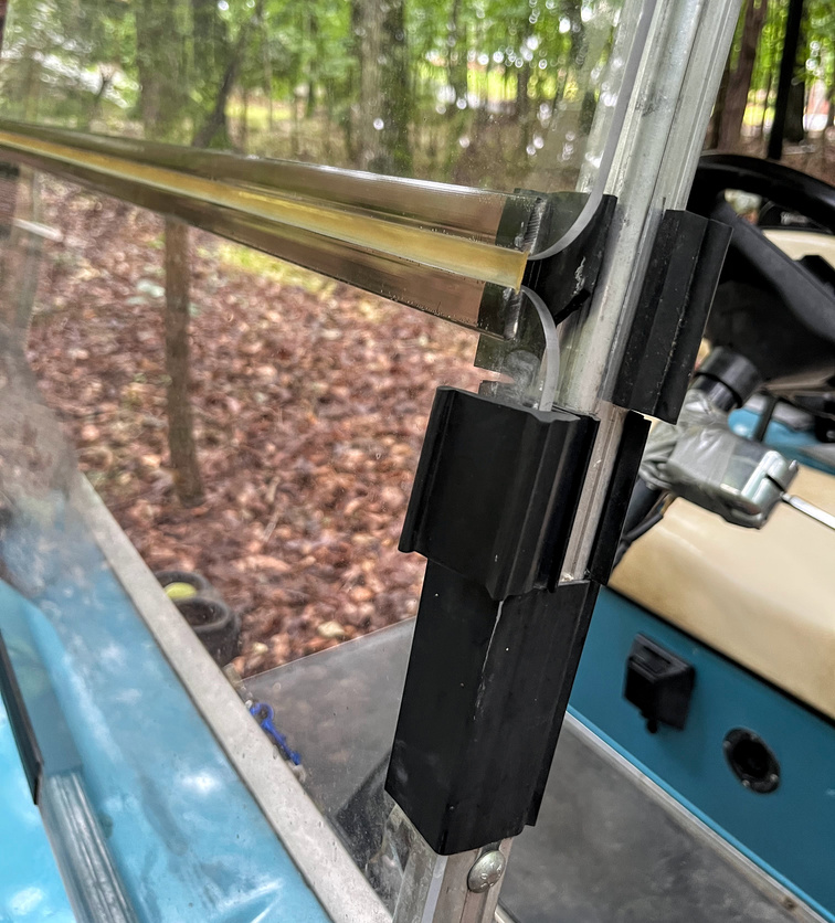 golf cart windshield folded down with rubber clips